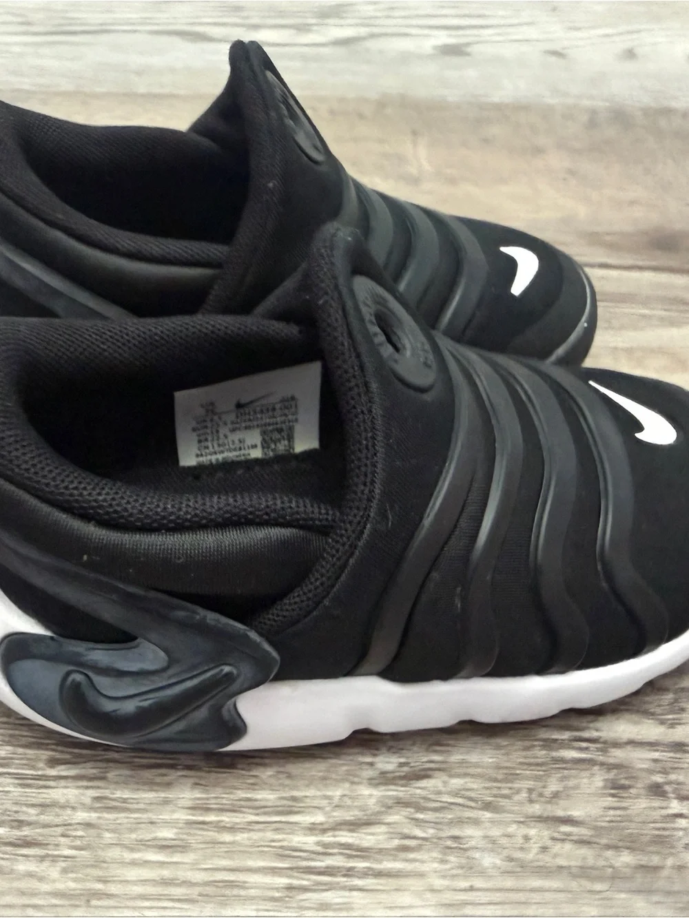 Nike Dynamo Go Kids Black Slip-On Sneakers with White Swoosh